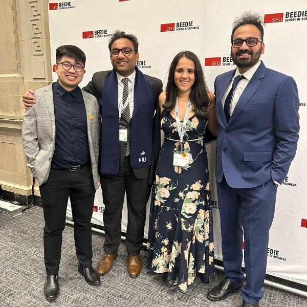 Ashutosh Mishra poses with other attendees at the Reaching Out MBA (ROMBA) 2SLGBTQ+ conference.