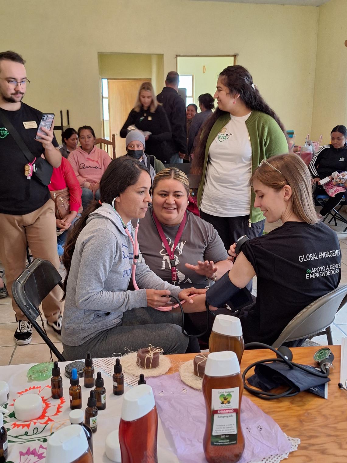 Nursing students practice taking blood pressure