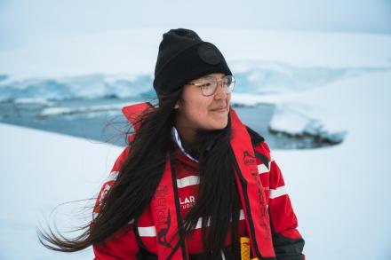 Jessica in a snowy Arctic environment wearing a toque and warm jacket