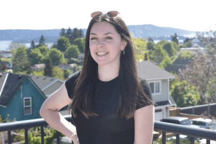 Jane Dean looking at the camera on a sunny day and smiling