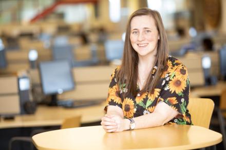 Sherry Wessel sits at a table in the library at VIU's Nanaimo campus