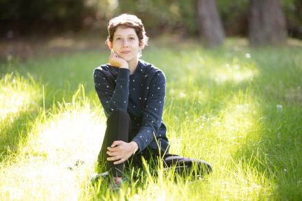 Student sitting in grass