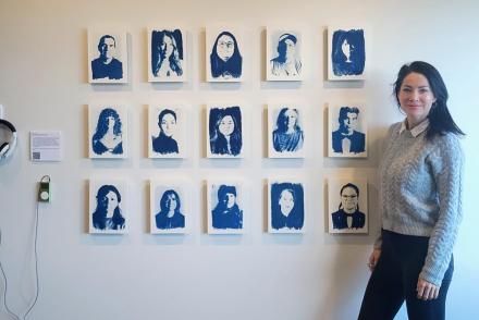 Tarah Dowling stands next to her exhibit.