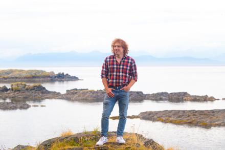 Ted with the ocean behind him