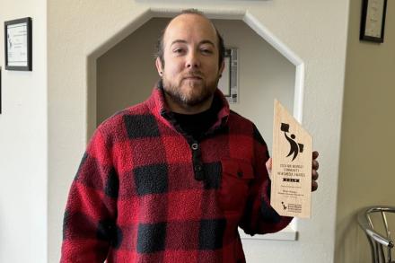 Tyson holds up his Ma Murray award